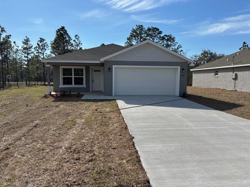 Front exterior of a new home in , Dunnellon, FL, highlighting curb appeal (Image 1). Front exterior of a new home in , Dunnellon, FL, highlighting curb appeal (Image 1).