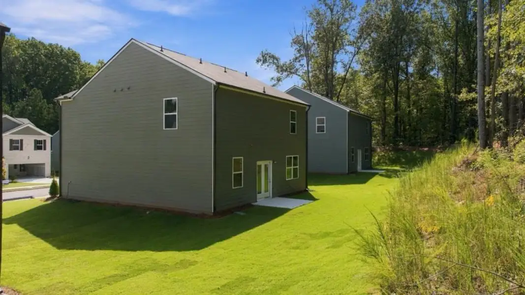 Exterior details and patio area of a home in Oaks at Cedar Grove, Fairburn (Image 3).
