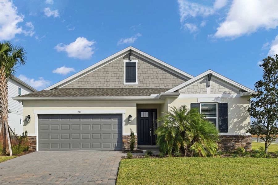 Representative exterior photo of a completed home built from the Grenada by Taylor Morrison in Ardisia Park, New Smyrna Beach, FL (Image 2).