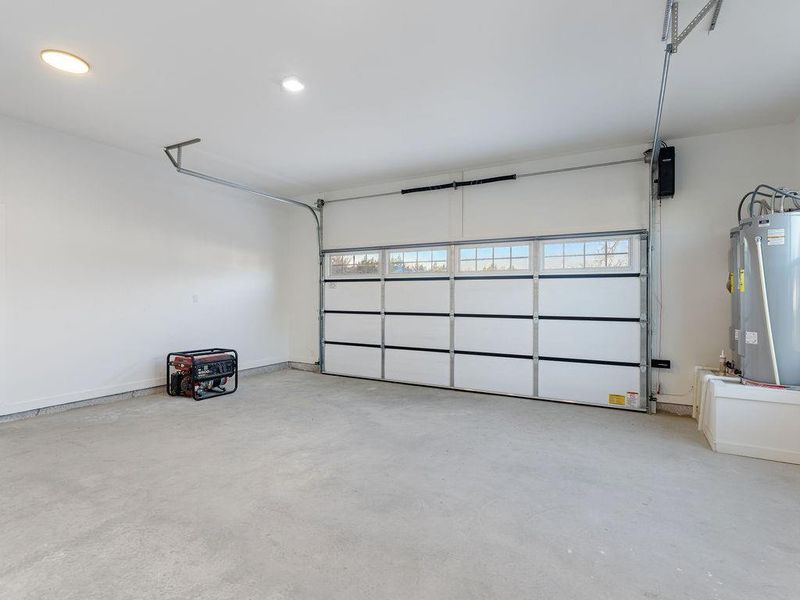 Garage featuring water heater