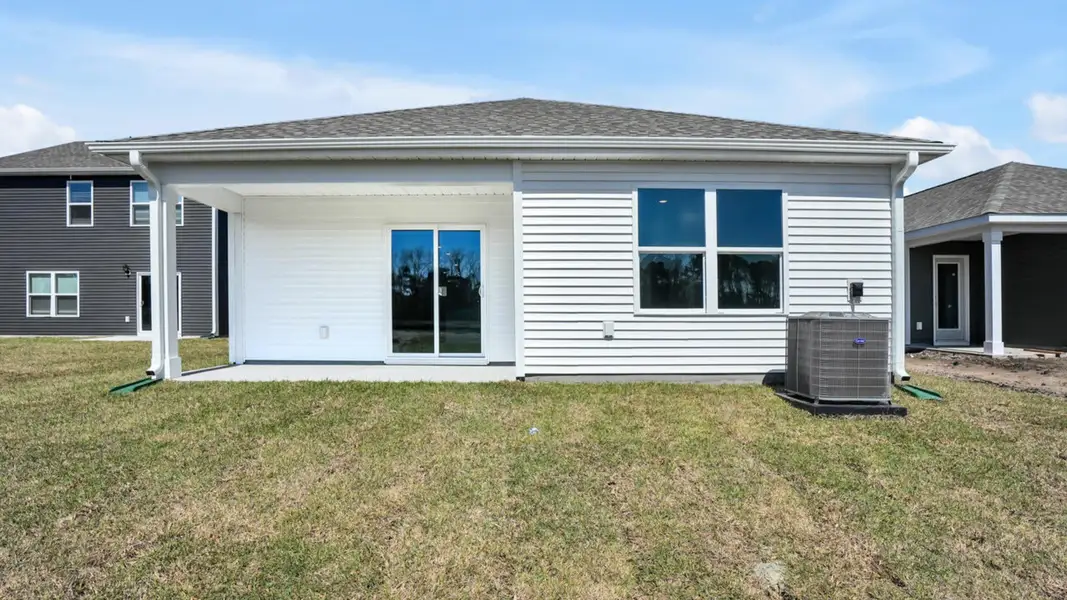 Exterior details and patio area of a home in Lockwood Landing, Supply (Image 3).