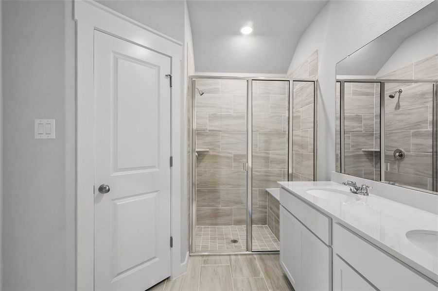 Full bath with a shower stall and double vanity Full bath with a shower stall and double vanity
