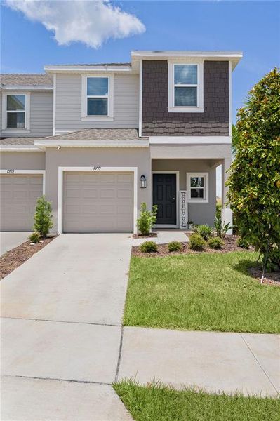 Front exterior of a new home in Waterstone, Groveland, FL, highlighting curb appeal (Image 28).