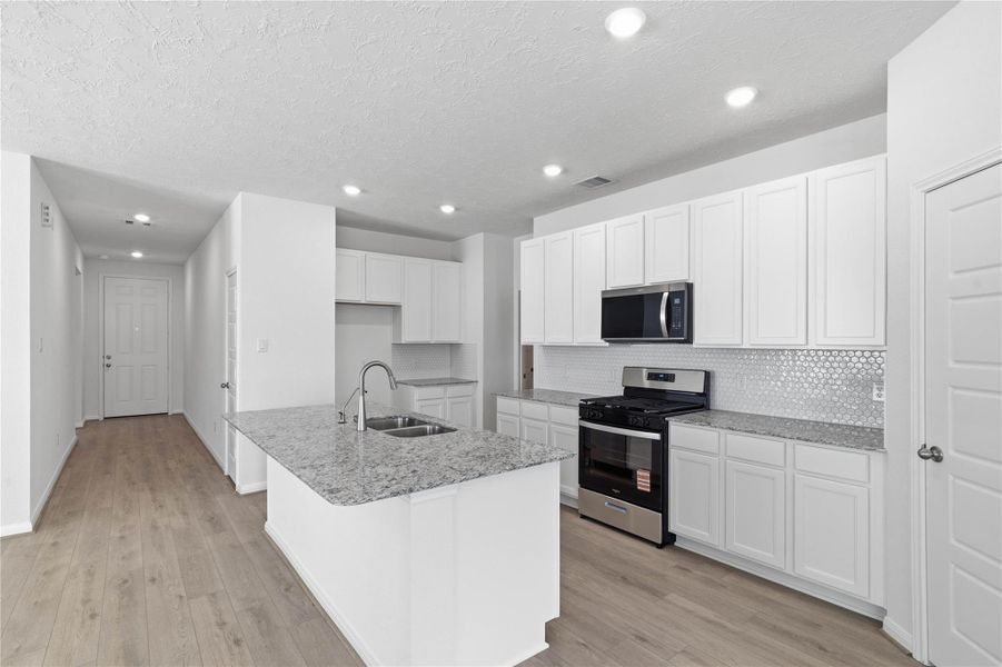 The granite countertops - White Napoli, and the Daltile backsplash is Artezen Hexagon Mosaic in Elegant White. The granite countertops - White Napoli, and the Daltile backsplash is Artezen Hexagon Mosaic in Elegant White.