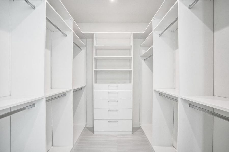 Primary Suite Closets — Dual walk-in closets, each individually configurable to suit personal style and storage needs, offering everyday convenience and personal space.