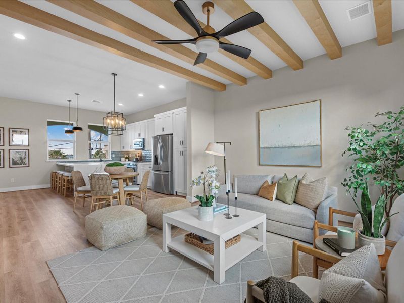 Take in this alternate view of the spacious living area, showcasing its perfectconnectivity to the kitchen and dining area. The open layout ensures effortless flow, making it ideal forboth intimate gatherings and larger entertainment. Take in this alternate view of the spacious living area, showcasing its perfectconnectivity to the kitchen and dining area. The open layout ensures effortless flow, making it ideal forboth intimate gatherings and larger entertainment.