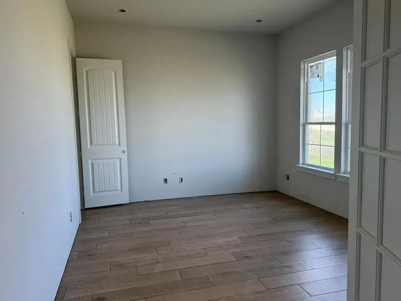Spare room featuring light wood-style flooring