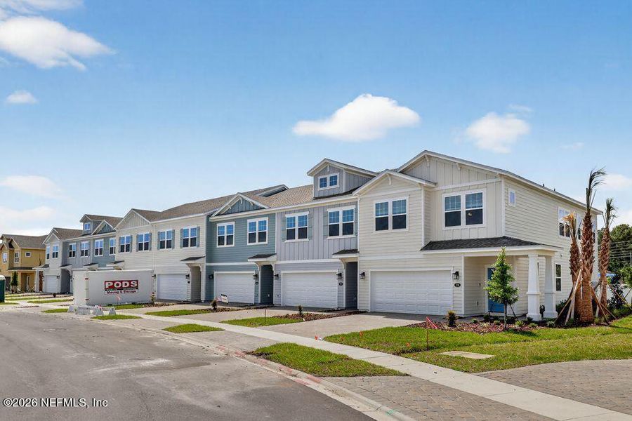 Front exterior of a new home in Cherry Elm at SilverLeaf, St. Augustine, FL, highlighting curb appeal (Image 20).