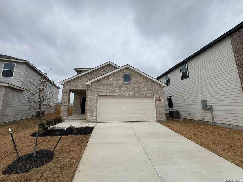 Front exterior of a new home in Hennersby Hollow, San Antonio, TX, highlighting curb appeal (Image 16). Front exterior of a new home in Hennersby Hollow, San Antonio, TX, highlighting curb appeal (Image 16).