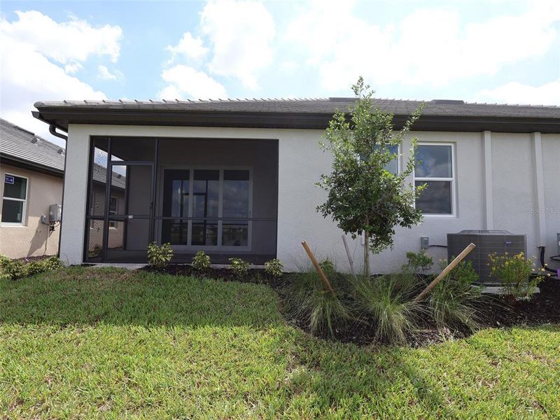 Exterior details and patio area of a home in Sweetwater at Lakewood Ranch, Lakewood Ranch (Image 1).
