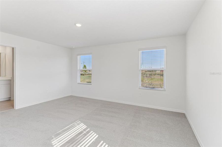 Spacious, unfurnished interior of a new home in The Reserve at Hammock Oaks Townes, Lady Lake (Image 27).