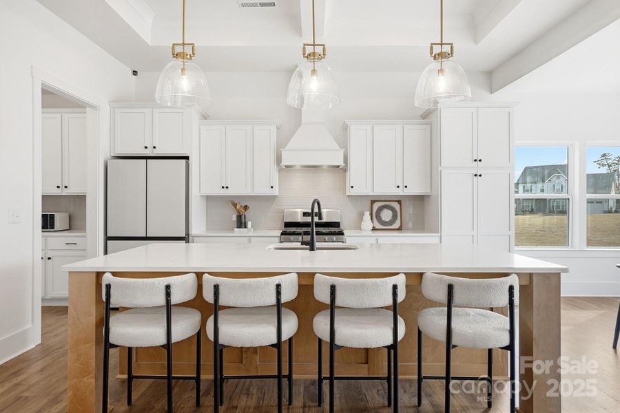 Open Kitchen with Quartz Countertops and Large Island