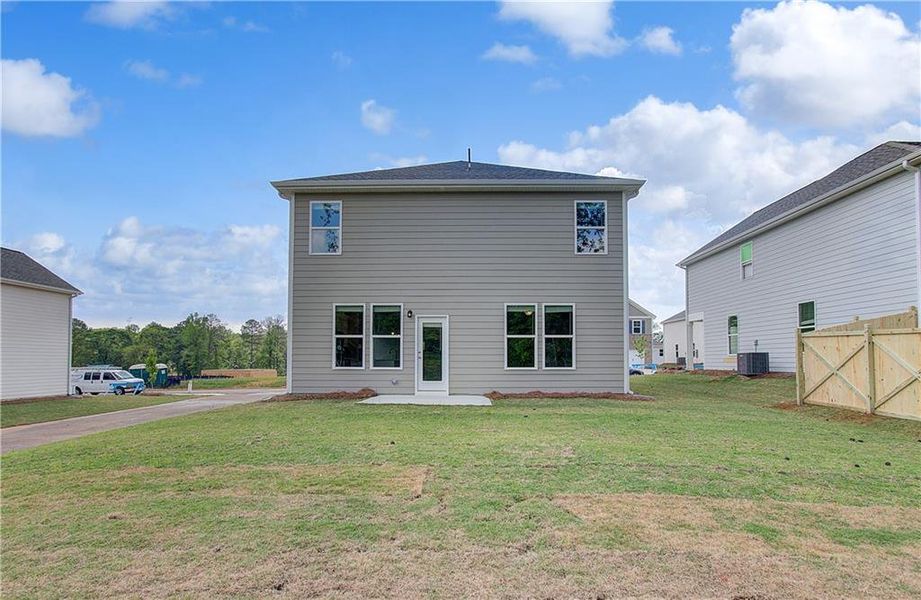 Exterior details and patio area of a home in Enclave at Evergreen, Fairburn (Image 3).