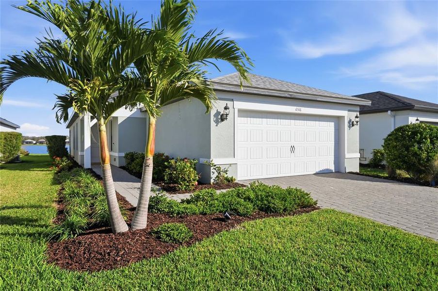 Front exterior of a new home in , Sarasota, FL, highlighting curb appeal (Image 22). Front exterior of a new home in , Sarasota, FL, highlighting curb appeal (Image 22).