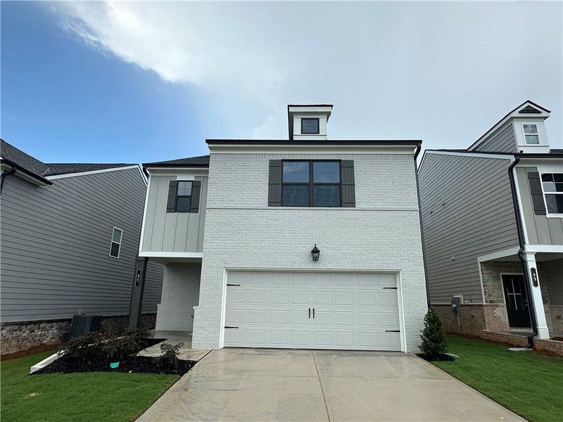 Front exterior of a new home in Kentmere, Auburn, GA, highlighting curb appeal (Image 1). Front exterior of a new home in Kentmere, Auburn, GA, highlighting curb appeal (Image 1).