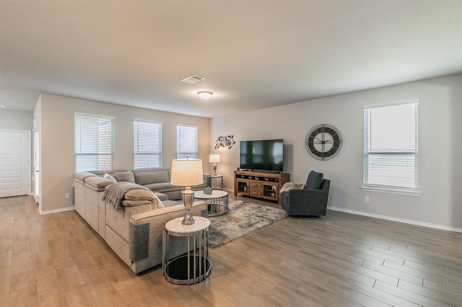 Living room with light wood-type flooring