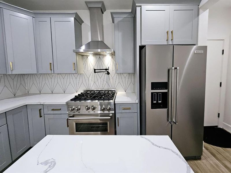 Kitchen view showing the beautiful Kitchen Aid refrigerator.