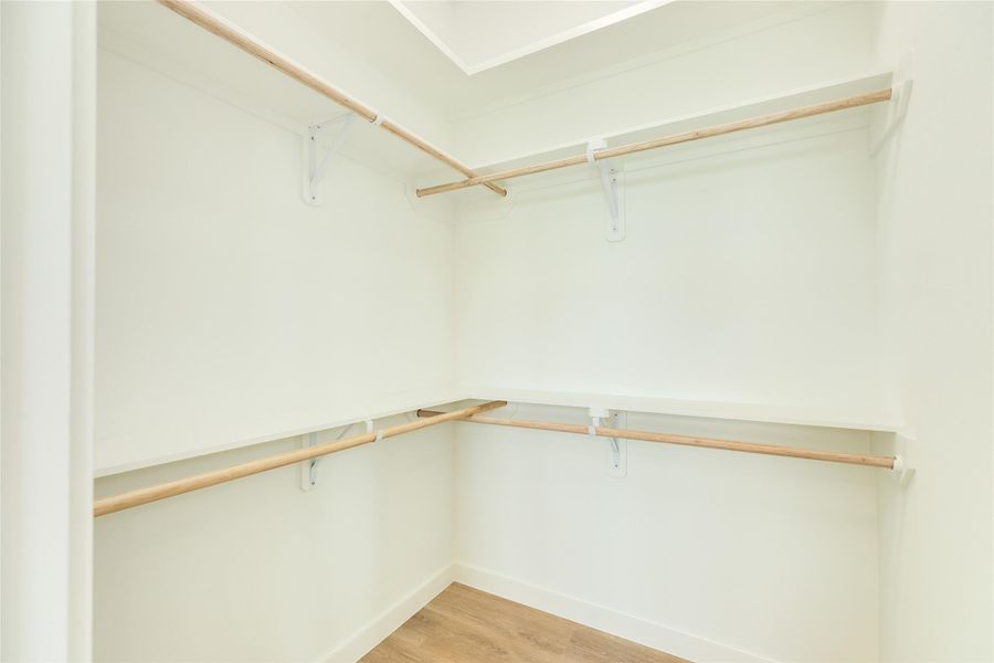 Spacious closet in the primary bedroom.