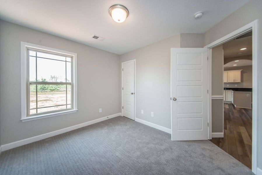 Representative unfurnished interior of a home built from the Pacific by Enchanted Homes in Hampshire Heights, Moore (Image 33).