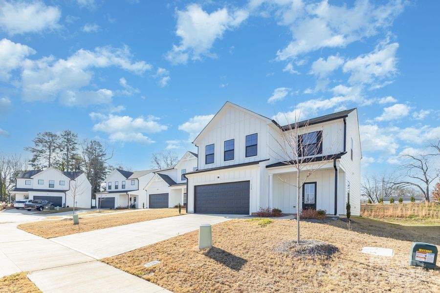Front exterior of a new home in , Mooresville, NC, highlighting curb appeal (Image 16).