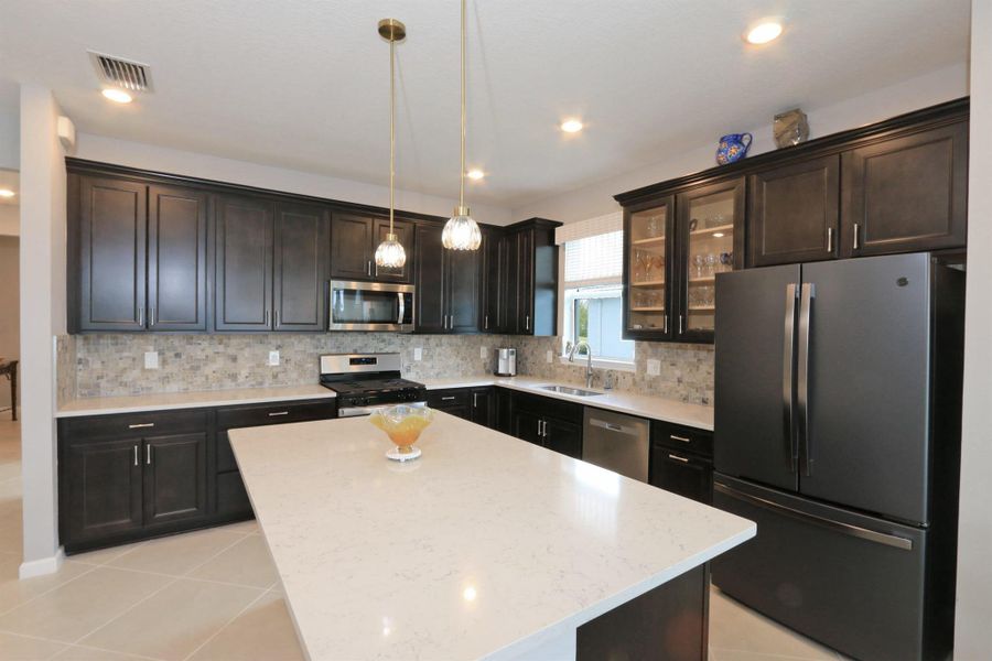 Furnished interior view inside a new home in , Port St. Lucie (Image 34).