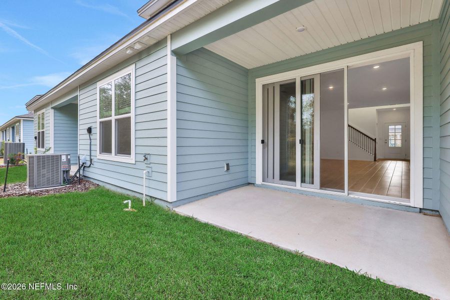 Exterior details and patio area of a home in The Hammock at Palm Harbor, Palm Coast (Image 20).
