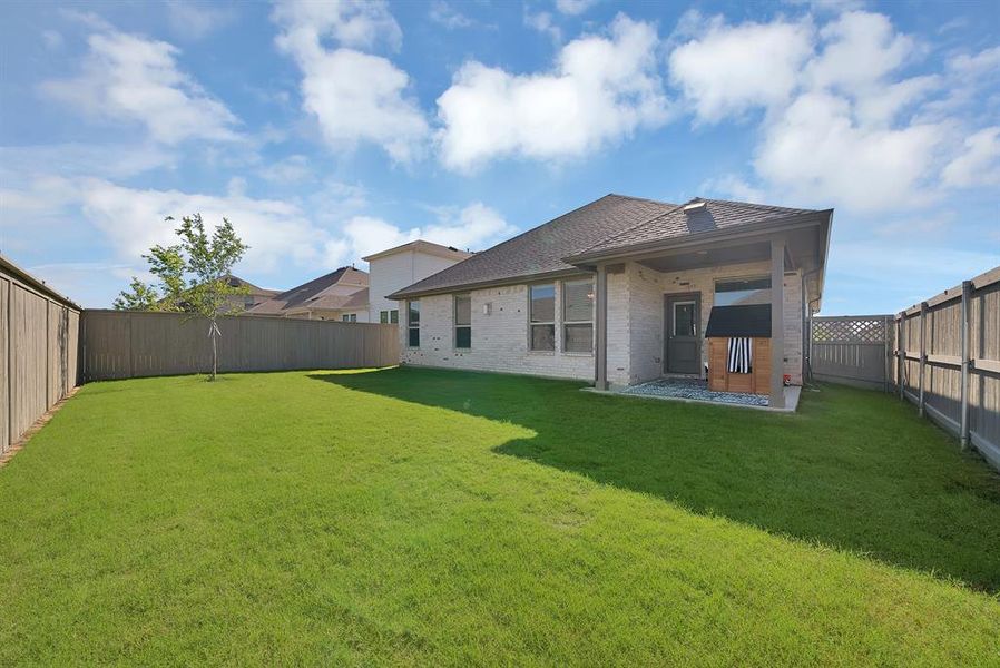 Exterior details and patio area of a home in Pecan Square, Northlake (Image 4).