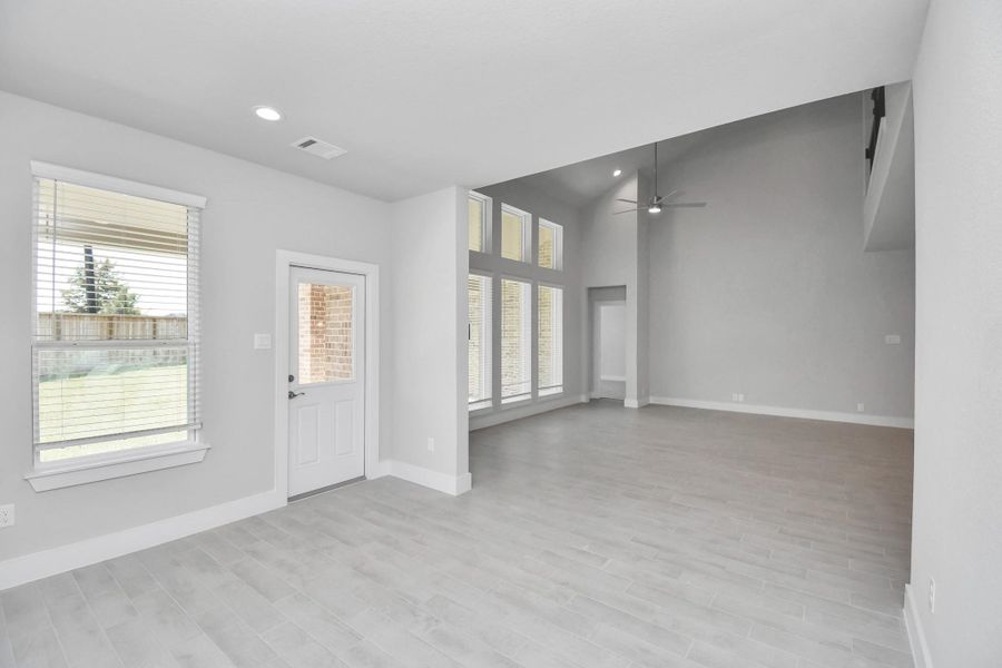 Make memories gathered around the table with your family and friends! This spacious dining room features elegant flooring, custom paint, and adjacent to family room and kitchen for open concept feel. Sample photo of completed home with similar floor plan. Actual colors and selections may vary. Make memories gathered around the table with your family and friends! This spacious dining room features elegant flooring, custom paint, and adjacent to family room and kitchen for open concept feel. Sample photo of completed home with similar floor plan. Actual colors and selections may vary.