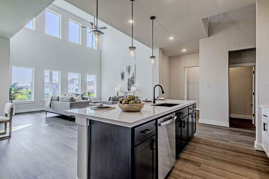 Large kitchen island offering generous prep space, storage, and seating
