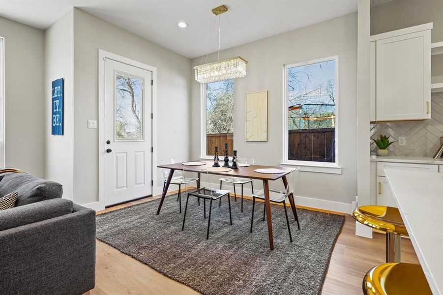 Dining area featuring recessed lighting, light wood-style flooring, and baseboards