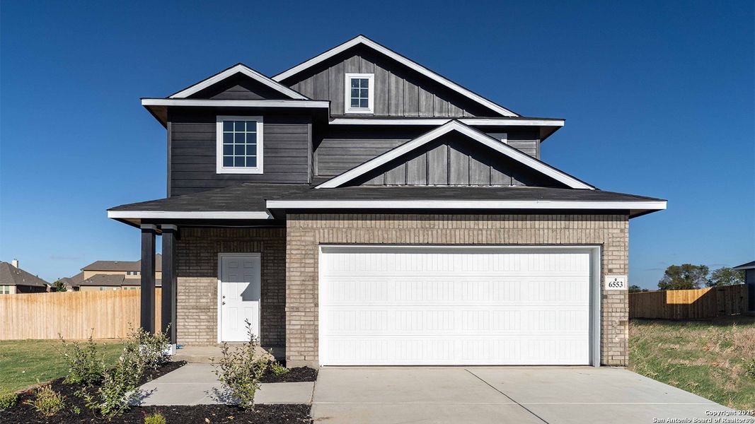 Front exterior of a new home in Willow View, Converse, TX, highlighting curb appeal (Image 1).