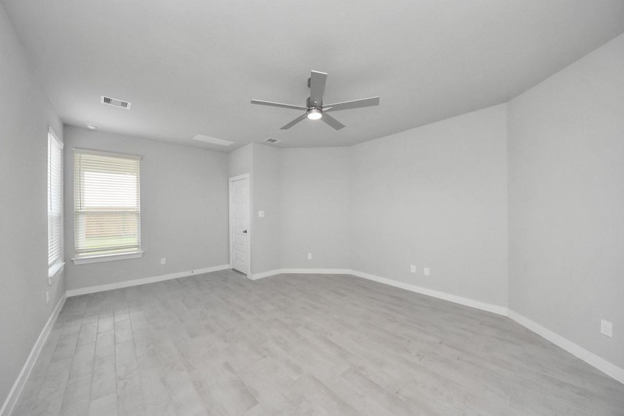 Another perspective unveils a comprehensive view of the serenity and comfort this primary suite offers. Sample photo of completed home with similar floor plan. Actual colors and selections may vary. Another perspective unveils a comprehensive view of the serenity and comfort this primary suite offers. Sample photo of completed home with similar floor plan. Actual colors and selections may vary.