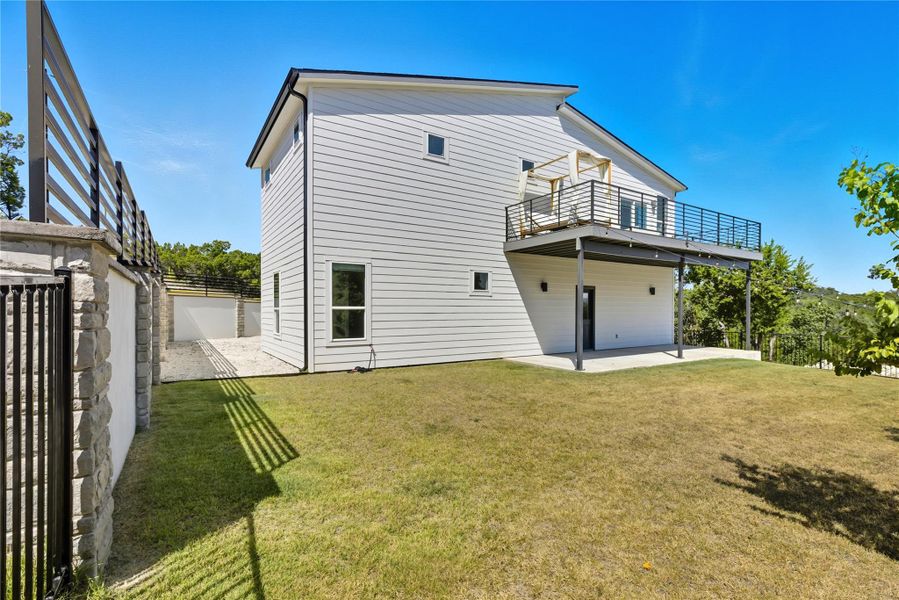 Back of property featuring a patio area and a fenced backyard