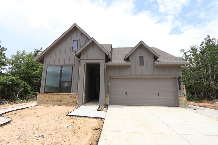 Front exterior of a new home in Colton 45' Homesites, Todd Mission, TX, highlighting curb appeal (Image 24).
