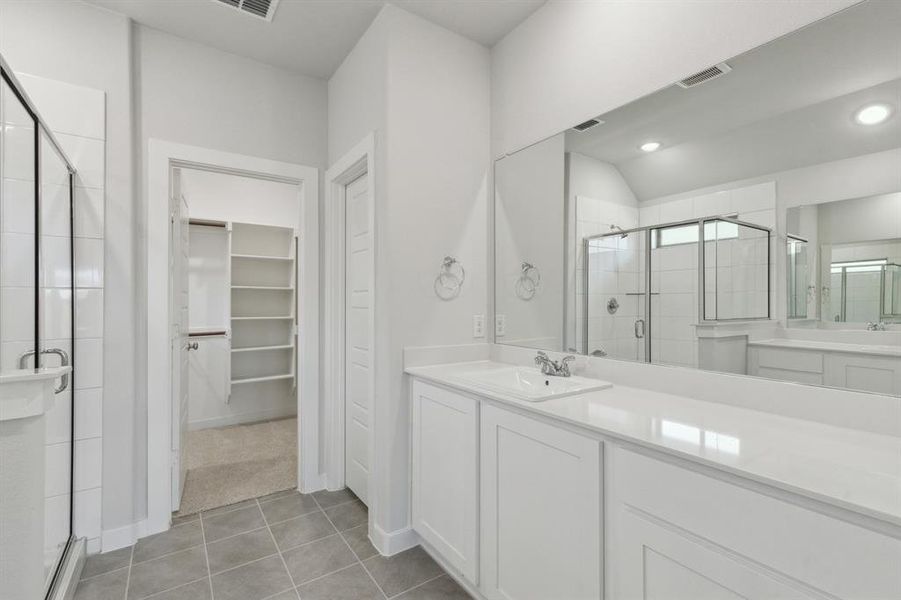 Primary Bathroom in the Heisman home plan by Trophy Signature Homes – REPRESENTATIVE PHOTO