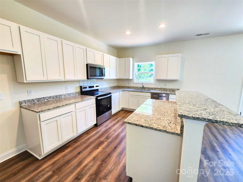Gleaming White Cabinets and Granite