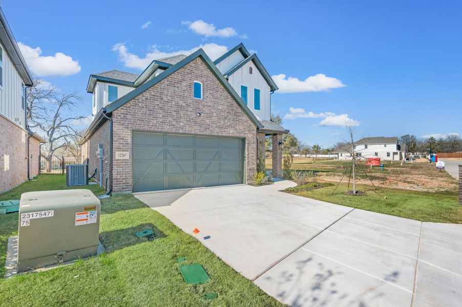 Front exterior of a new home in The Resort on Eagle Mt. Lake, Fort Worth, TX, highlighting curb appeal (Image 2). Front exterior of a new home in The Resort on Eagle Mt. Lake, Fort Worth, TX, highlighting curb appeal (Image 2).