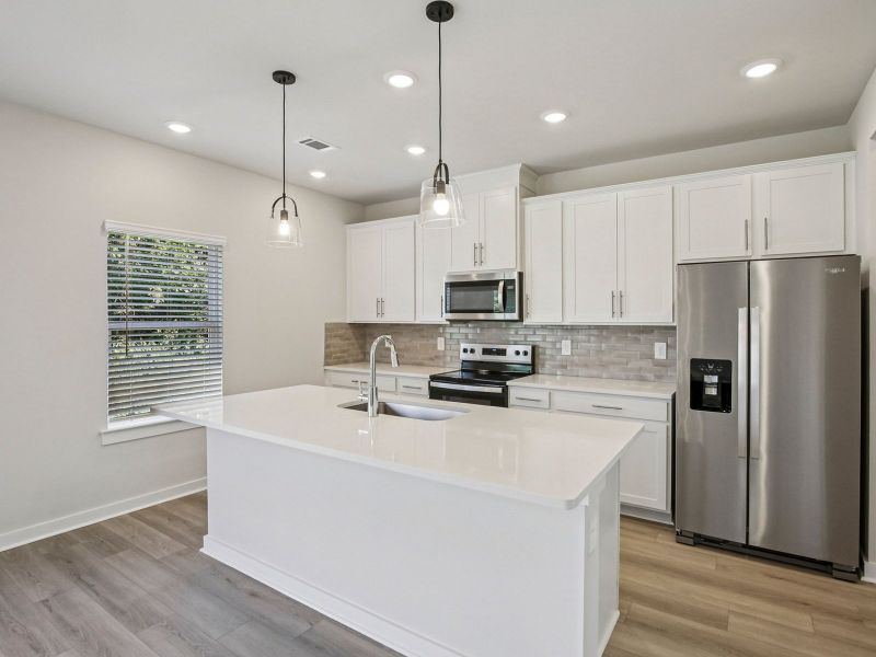 Prep dinner in the kitchen without missing the conversation in the great room.