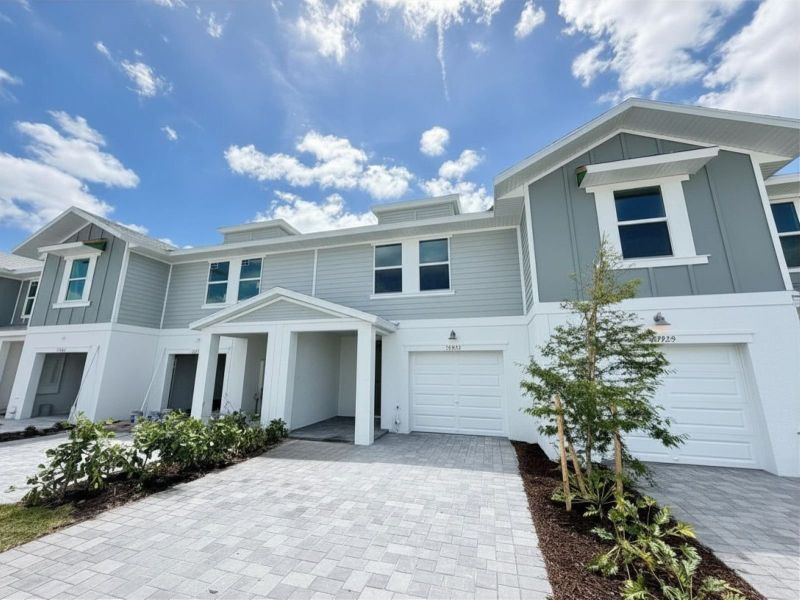 Front exterior of a new home in Meritage Homes at Central Park, Port St. Lucie, FL, highlighting curb appeal (Image 10).