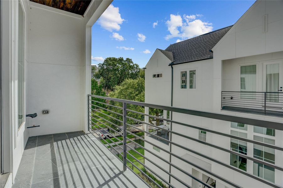 The private balcony off the primary bedroom overlooks the community and is ideal for a morning cup of coffee. The private balcony off the primary bedroom overlooks the community and is ideal for a morning cup of coffee.