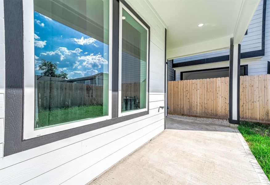 Covered patio area offering a comfortable transition between indoor and outdoor living.