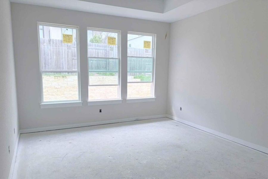 Spare room featuring healthy amount of natural light