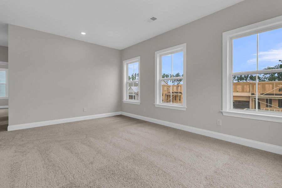 Spacious, unfurnished interior of a new home in Tidewater at Lakes of Cane Bay, Summerville (Image 32).