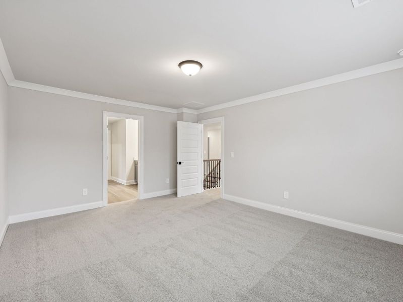 Spacious, unfurnished interior of a new home in Vines at Mill Creek - Estate Series, Braselton (Image 16).