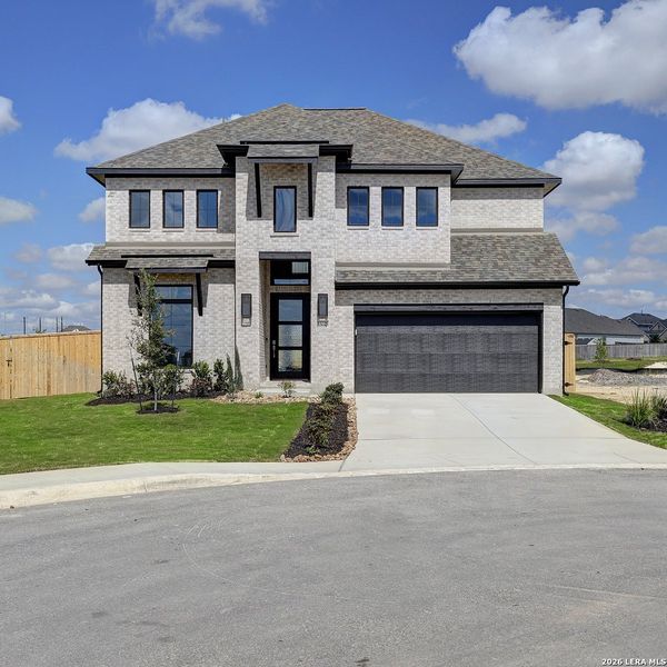 Front exterior of a new home in Ladera, San Antonio, TX, highlighting curb appeal (Image 1). Front exterior of a new home in Ladera, San Antonio, TX, highlighting curb appeal (Image 1).