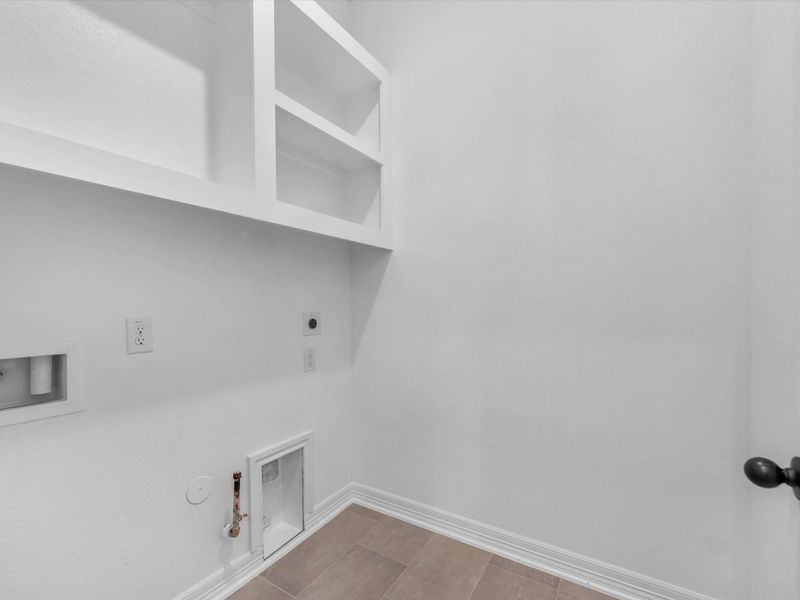 Laundry room. Sample product photo. Actual exterior and interior selections may vary by homesite. Photo may be virtually staged.