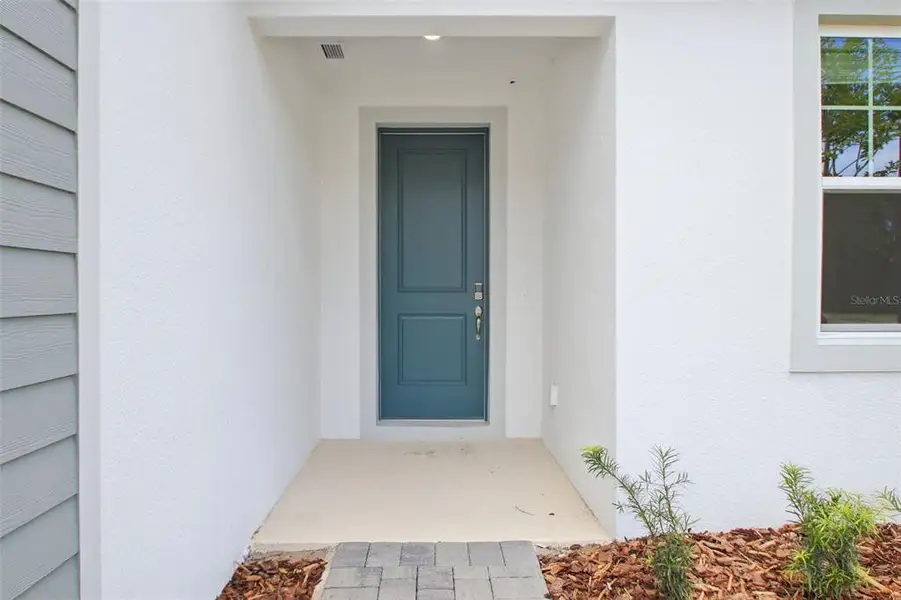 Exterior details and patio area of a home in Ridgehaven - Reserve Series, Ormond Beach (Image 3).