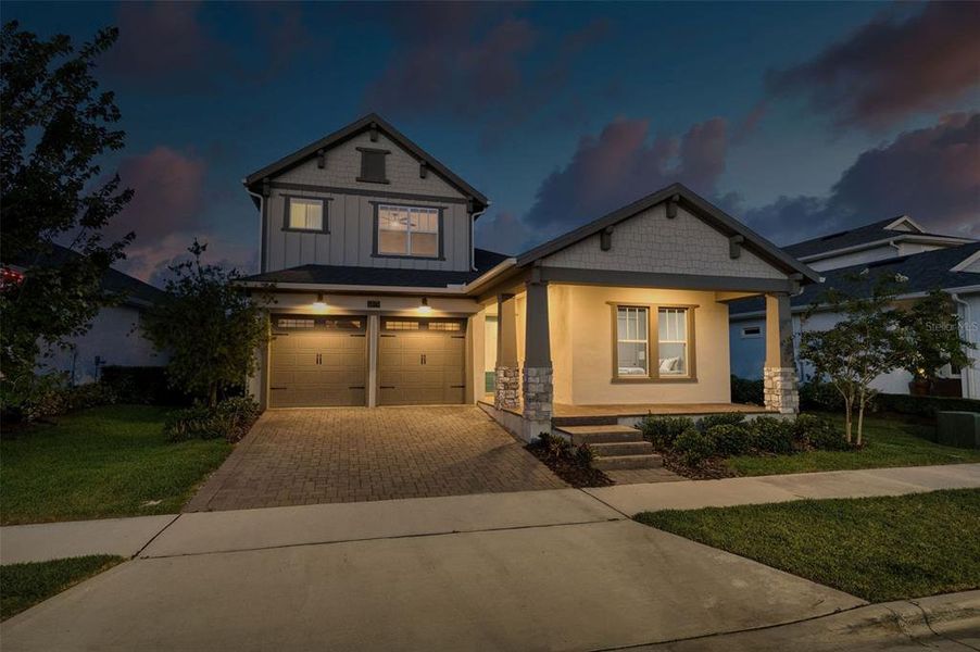 Front exterior of a new home in Laureate Park, Orlando, FL, highlighting curb appeal (Image 2). Front exterior of a new home in Laureate Park, Orlando, FL, highlighting curb appeal (Image 2).