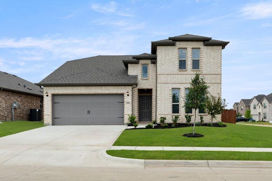 Front exterior of a new home in Keeneland, Aubrey, TX, highlighting curb appeal (Image 14).