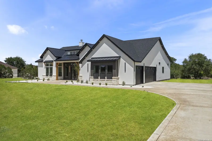 Front exterior of a new home in , Bandera, TX, highlighting curb appeal (Image 1). Front exterior of a new home in , Bandera, TX, highlighting curb appeal (Image 1).